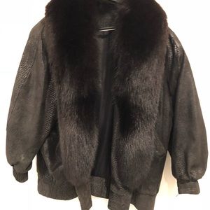 Black leather jacket/with black fox collar.